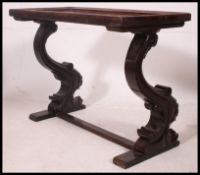 An Edwardian mahogany inlaid side table being raised on unusual shaped supports with inlaid