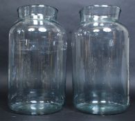 A pair of large continental glass pickle jars.