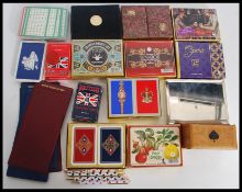 A collection of mid 20th century and later playing cards along with bridge pens and score boards
