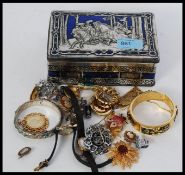 A collection of assorted vintage costume jewellery to include watches,