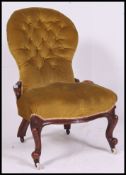 A Victorian mahogany spoon back ladies armchair / nursing chair.
