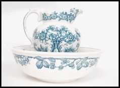 A 20th century large Staffordshire washbowl and jug in matching chintz pattern - unsigned to base