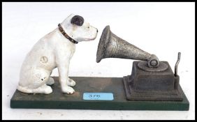 A vintage style cast iron hand painted HMV advertising figure,