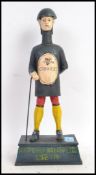 A reproduction metal Guinness advertising figure money box.