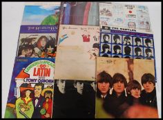 A collection of long play Vinyl records all relating to The Beatles to include With The Beatles,
