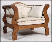 A fabulous 20th century retro Italian / Moorish window armchair having cream upholstery being