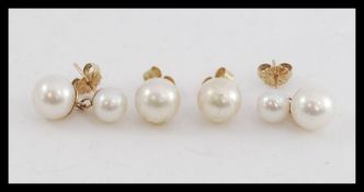 2 sets of ladies 9ct gold pearl earrings  - studs. Each cultured pearl on stud setting.