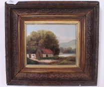 A mid century oil on board painting in frame of a lakeside cottage scene with woodland to rear,