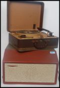 A vintage cased portable 1960's Defiant four speed two tone record player along with a portable