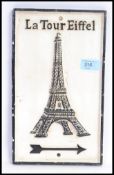 A vintage style cast iron Eiffel Tower sign.