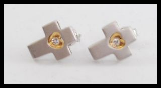 A pair of 18ct white gold and diamond ladies earrings - studs.