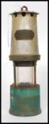 A vintage brass and aluminum miners lamp with plaque to front for makers J.H Naylor Ltd.