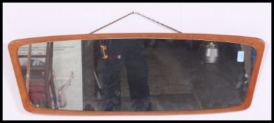 A large long retro 19670 vintage atomic style teak framed mirror.