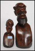A 20th century African tribal bust of polished carved mahogany.