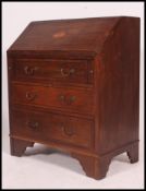 An Edwardian mahogany inlaid bureau.