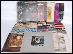 A collection of vinyl long play records to include Paul Simon, Melanie, Bob Downes, The Animals,