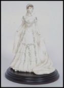 An original Coalport Compton & Woodhouse Limited Edition Queen Mary figurine.