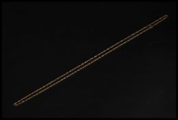 A long 9ct gold ladies figaro chain linked necklace complete with clasp. Total weight 6.