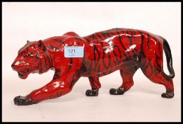 A good Royal Doulton Flambe designed Tiger. 37cm long.