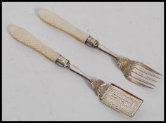 A hallmarked silver decorative fork and believed icecream spoon, hallmarked for S&I, Birmingham.