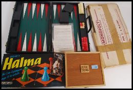 A collection of assorted vintage games to include Helma, Monopoly etc.