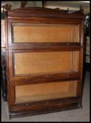 An Edwardian mahogany 3 tier lawyers - barristers stacking bookcase cabinet in the manner of Globe