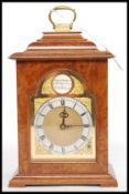 A Charles Frodsham ( Clockmakers to the Queen ) walnut bracket clock.