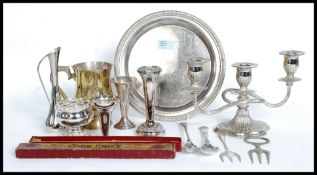 A collection of silver plated itemsv from the 20th century to include candlesticks, salver etc.