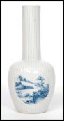 A Chinese blue and white 19th century ribbed vase.