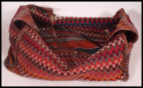 A large Afghan - kelim tent bag.