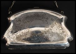 A silver plated ladies evening purse having hinged top,