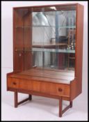 A good vintage 1960's Danish influenced teak display cabinet with lower base drawer and inset