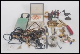 A collection of costume jewellery and curios to include necklaces, bracelets,