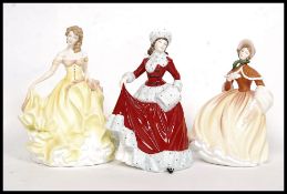 A collection of 3x Royal Doulton china ' Pretty Ladies ' figurines all being stamped to the base;