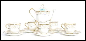 A vintage 20th century Staffordshire Tuscan Art Deco style pattern tea service comprising teapot