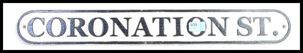 A reproduction wall hanging ' Cornishman ' railway train locomotive sign.