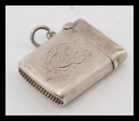 An Edwardian silver hallmarked vesta being chase decorated. Birmingham hallmarks for 1906.