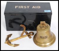 A vintage mid century first aid tin of pressed metal construction together with a brass wall bell