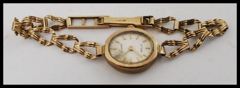 A 9ct gold / 375 marked ladies Geneve dress watch.