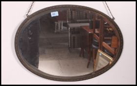 A 20th century brass surround wall mirror having a bevelled mirror panel.