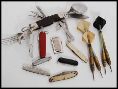 A set of 3 Jim Pike Darts together with another Jim Pike Dart, 2 with wooden shafts.