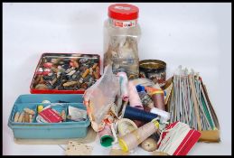 A collection of vintage sewing and needlework items to include 2 large tins of buttons,