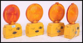 A set of British Railways Intercity warning lights with yellow bases and orange and red two tone