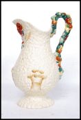 A large Clarice Cliff Celtic Harvest pattern jug of footed baluster form relief moulded with corn,