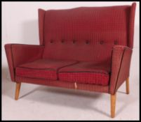 A retro 1950's 3 piece suite in the manner of Howard Keith.