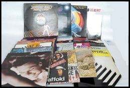 A collection of vinyl long play records from the 70's and 80's to include The Waterboys,