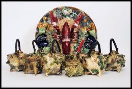 A collection of Majolica to include a Lobster and sealife decorated dish and a collection of