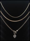 3 silver necklace chains, one with bar link and heart pendant.