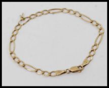 A 9ct gold / 375 marked  kerb lined bracelet with circular pendant.