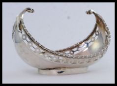 A solid silver Garrard and Co, London sugar bowl.